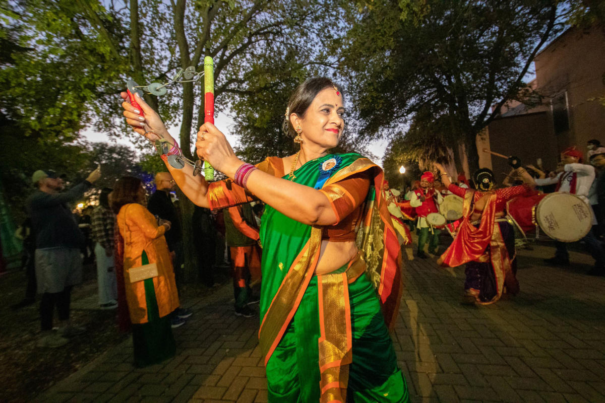 Woman dancing dressed in traditional Indian attire