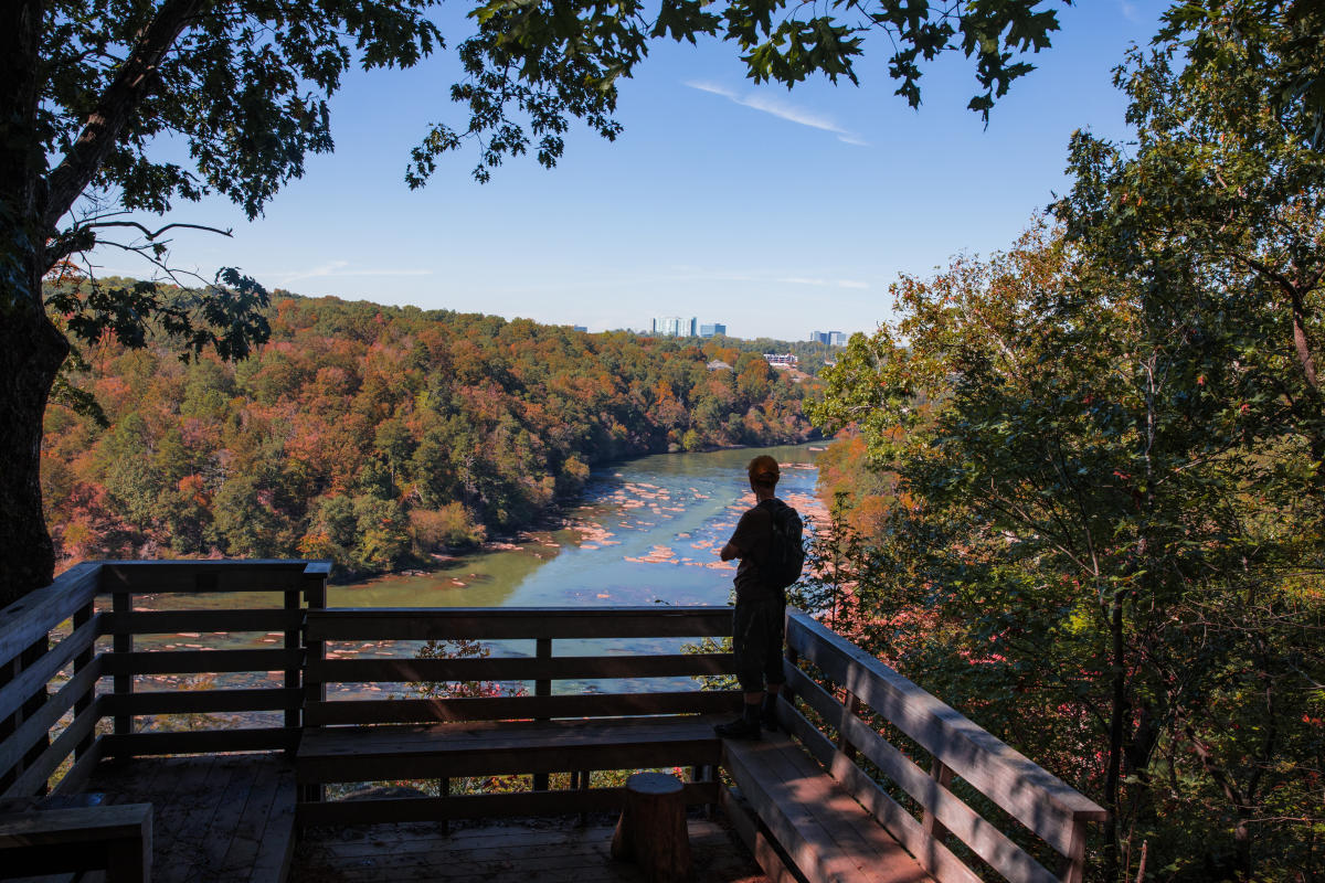 View of person looking out over the Chattahoochee River at Poppi's Point on the East Palisades