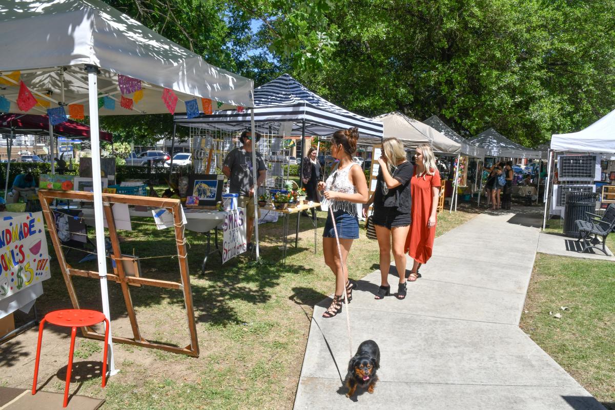 Crowd and vendors at art market