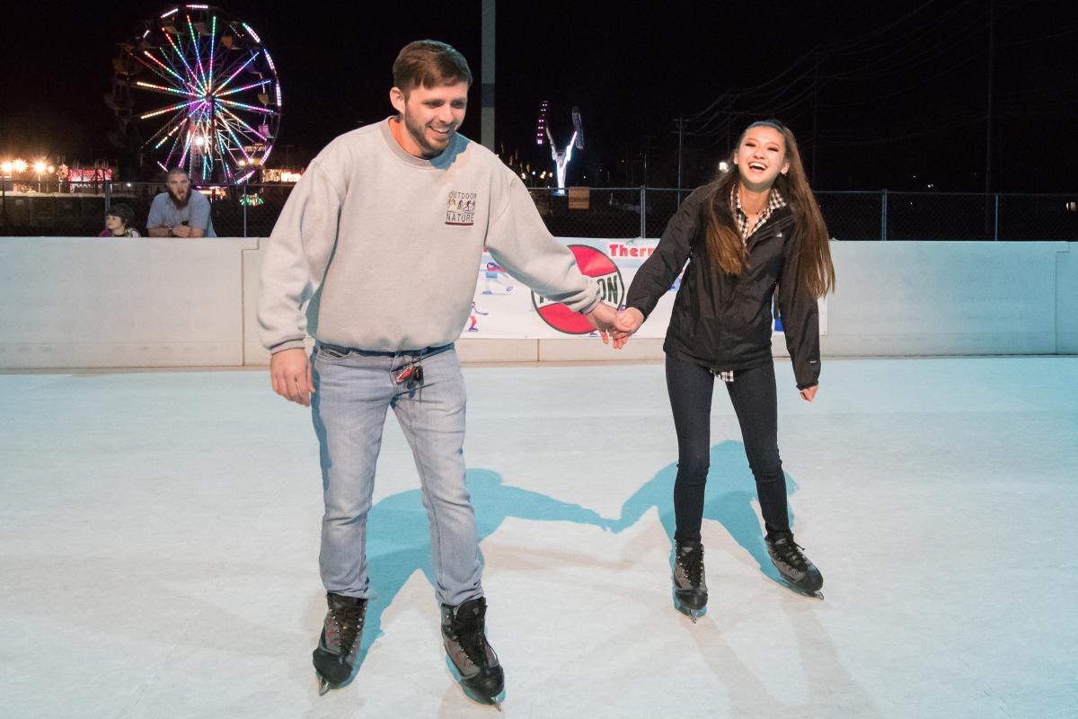 A couple ice skate Central Texas-style at Sights & Sounds of Christmas in San Marcos