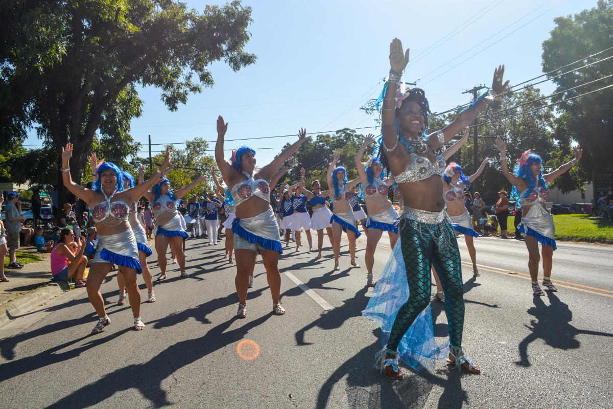A group of mermaids dance in the Mermaid Capital of Texas Fest in Downtown San Marcos, Texas