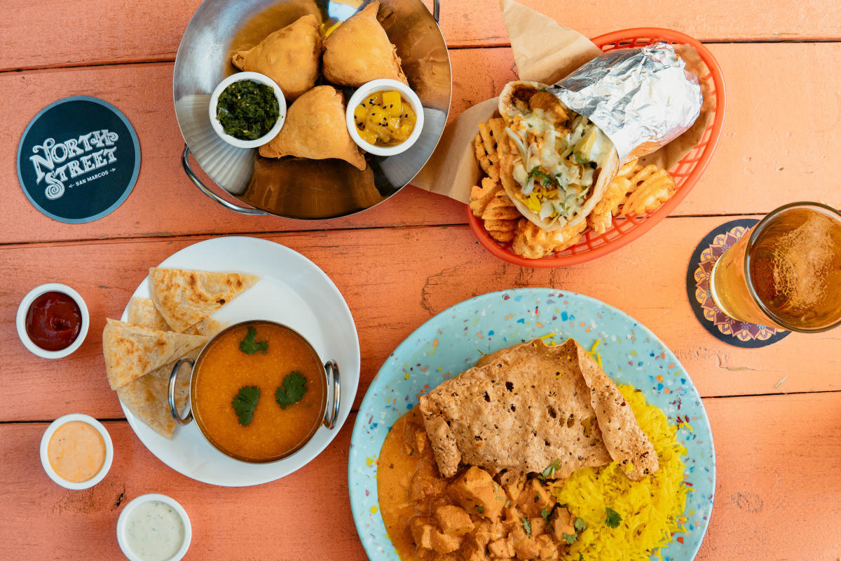 A brightly colored table full of delicious food from North Street in Downtown San Marcos, Texas