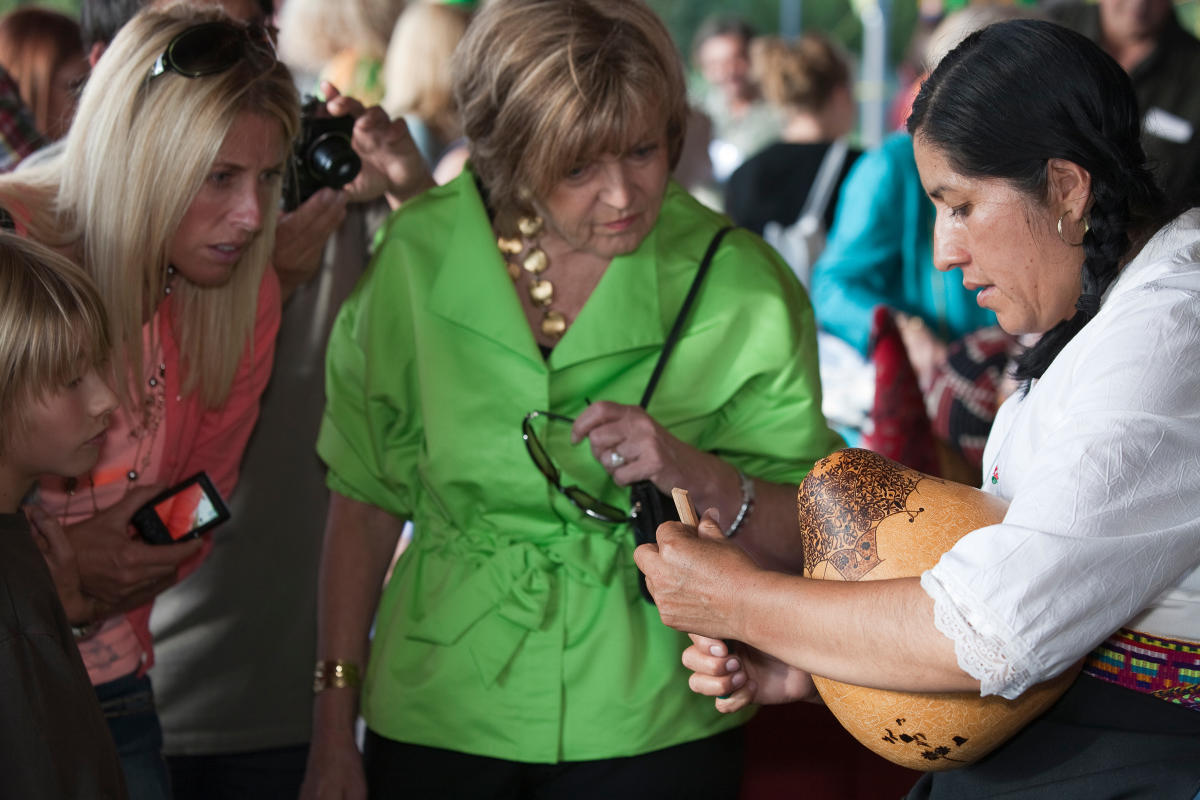 Demonstrating Peruvian gourd carving at International Folk Art Market