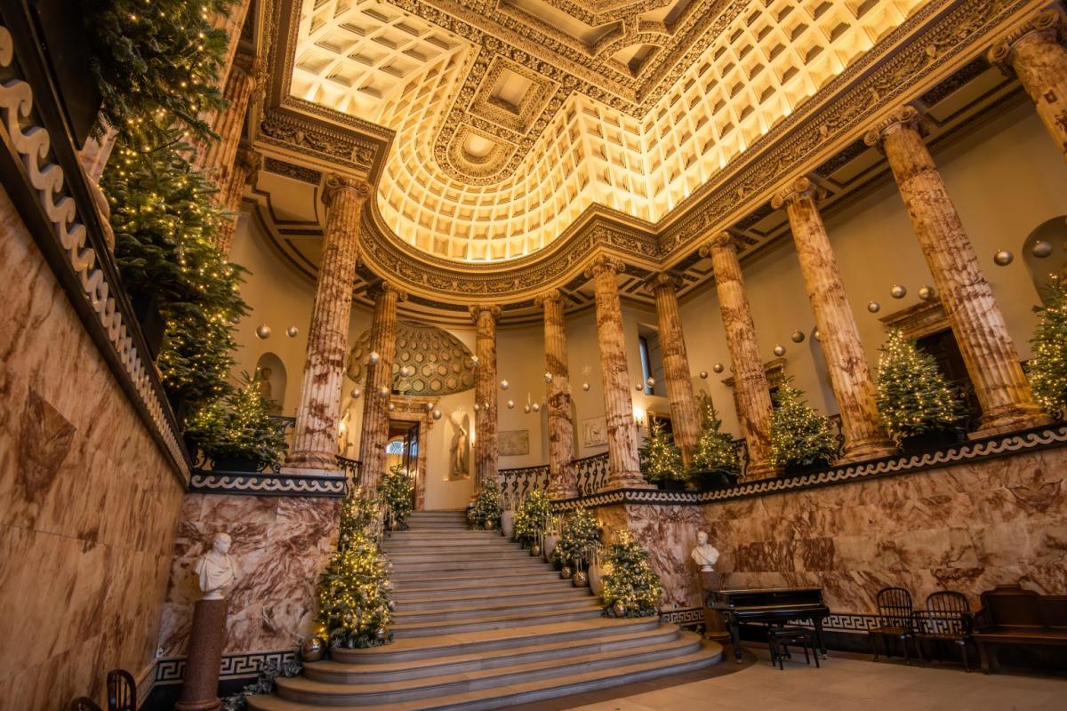 The interior of Norfolk's Holkham Hall, decorated for Christmas