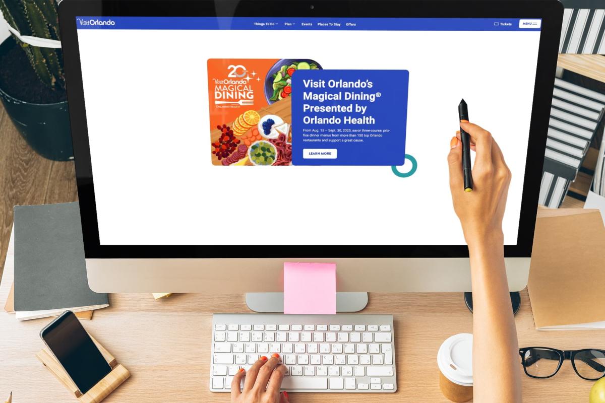 A desktop computer with the Magical Dining section of Visit Orlando's homepage opened.