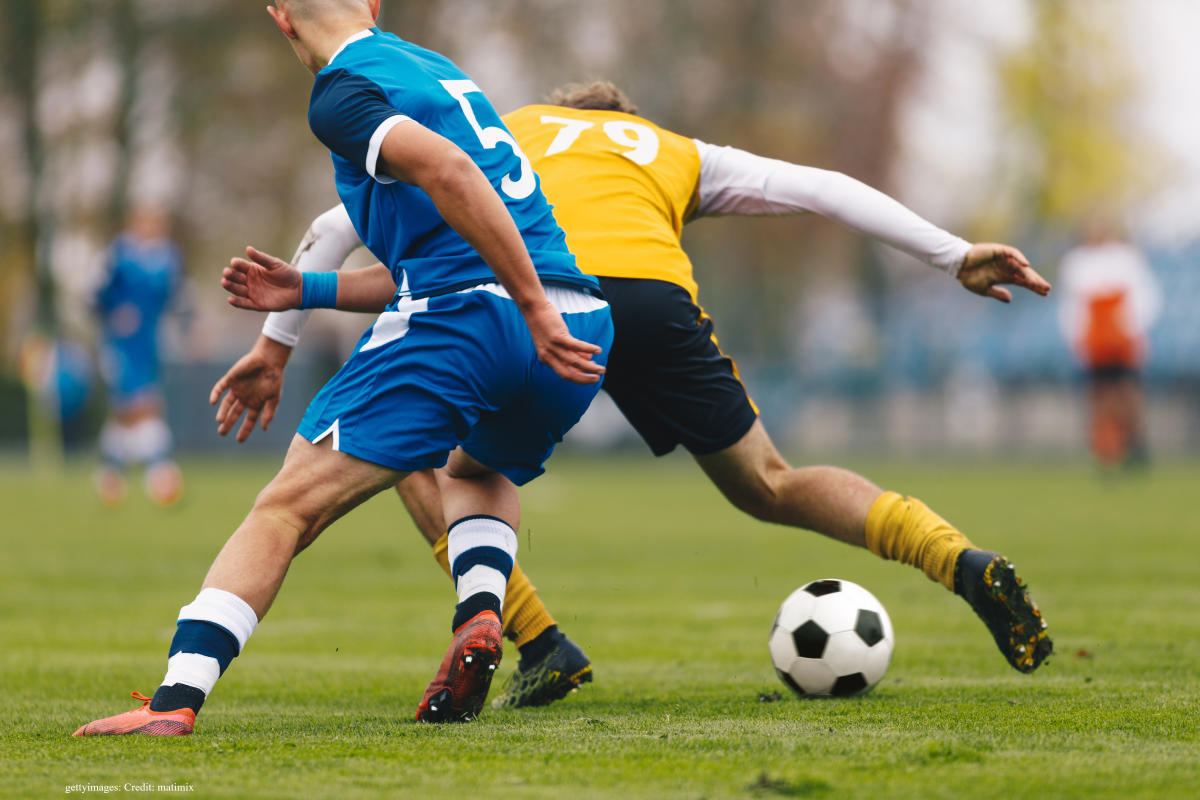 Football players on the pitch during a game