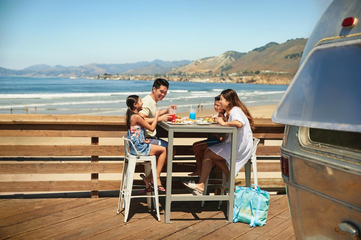 Family dining on a pier