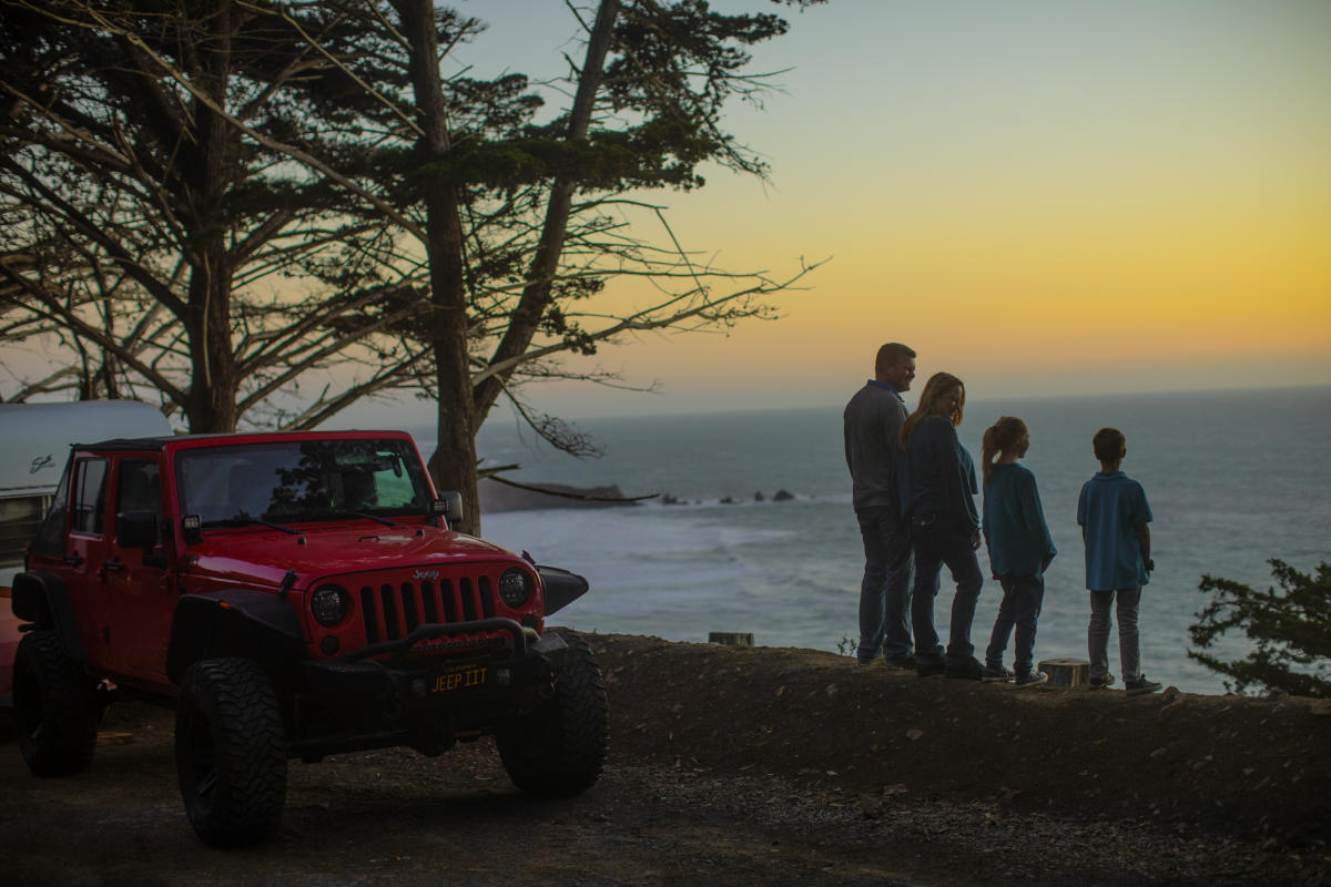 Family gazing at a the sunset at Ragged Point in SLO CAL