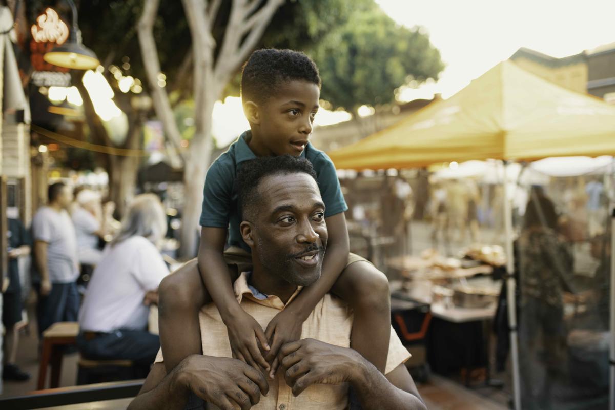 Father with his son on his shoulders at Farmers Market