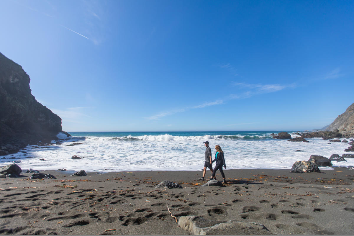 Couple walking San Simeon beach