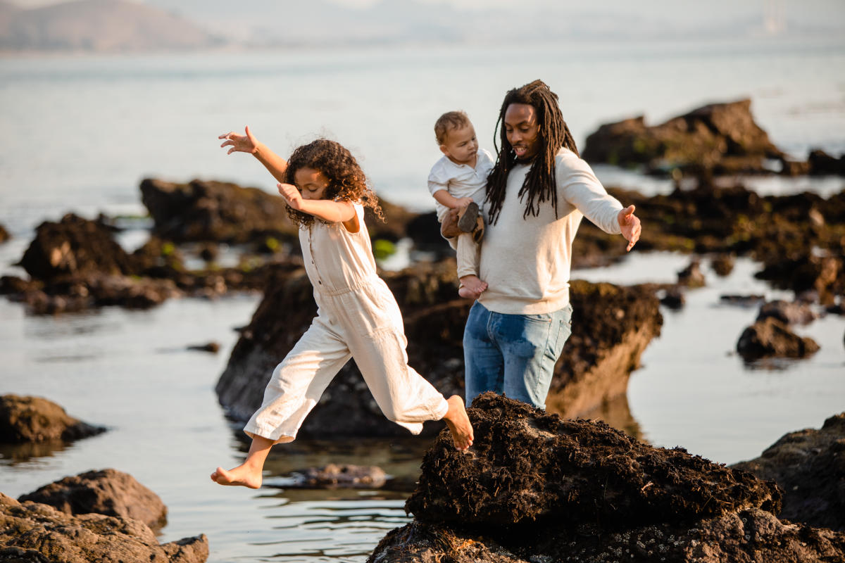 Family playing in tidepool near scenic Highway 1 in SLO CAL