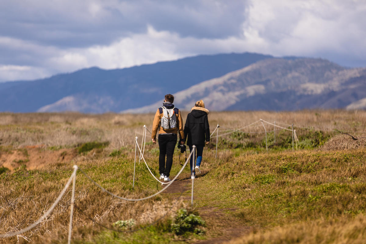 couple walking on trail in outdoors
