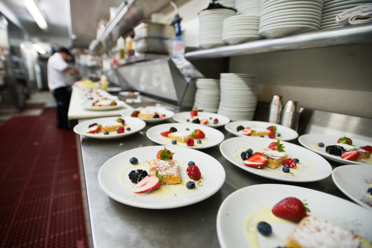 plates lined up in kitchen ready to be served