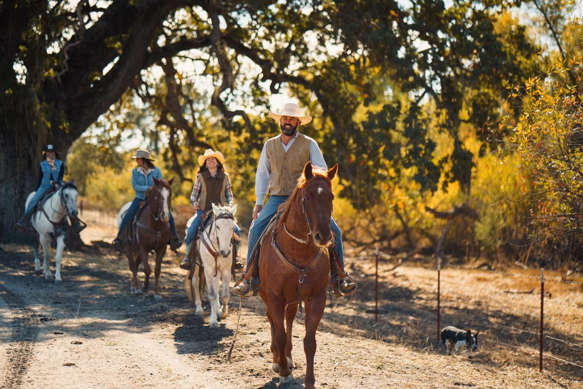 group horseback riding on a trail in SLO CAL