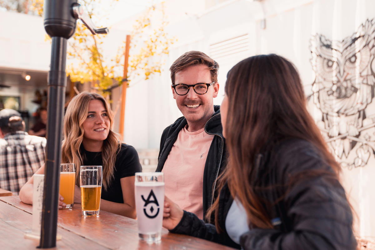 group enjoying drinks at Ancient Owl in Atascadero