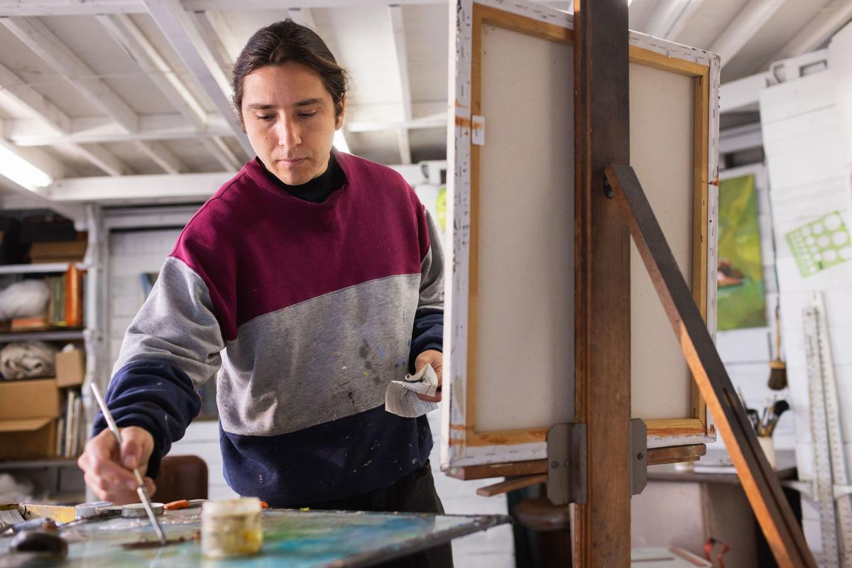 man painting in studio