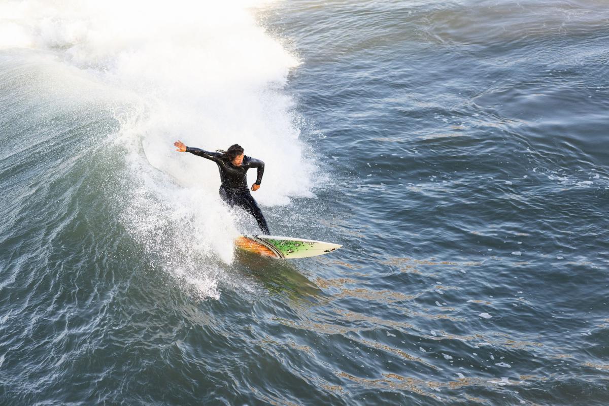 surfer surfing at pismo beach