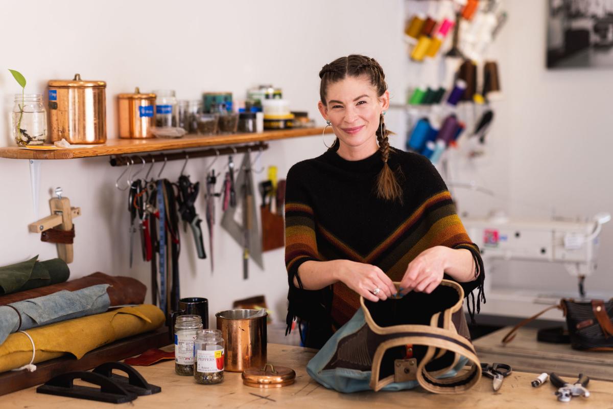 Emma Thieme, owner of Maven Leather, working on a purse in her studio in Cayucos, CA