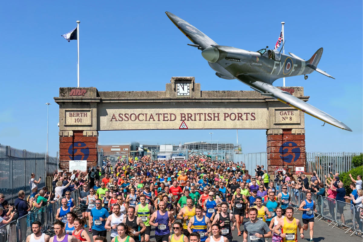 Spitfire flying above runners taking part at ABP Marathon