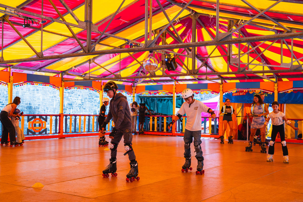 Families enjoying rollerblading in an indoor rink outside on The Esplanade by Westquay