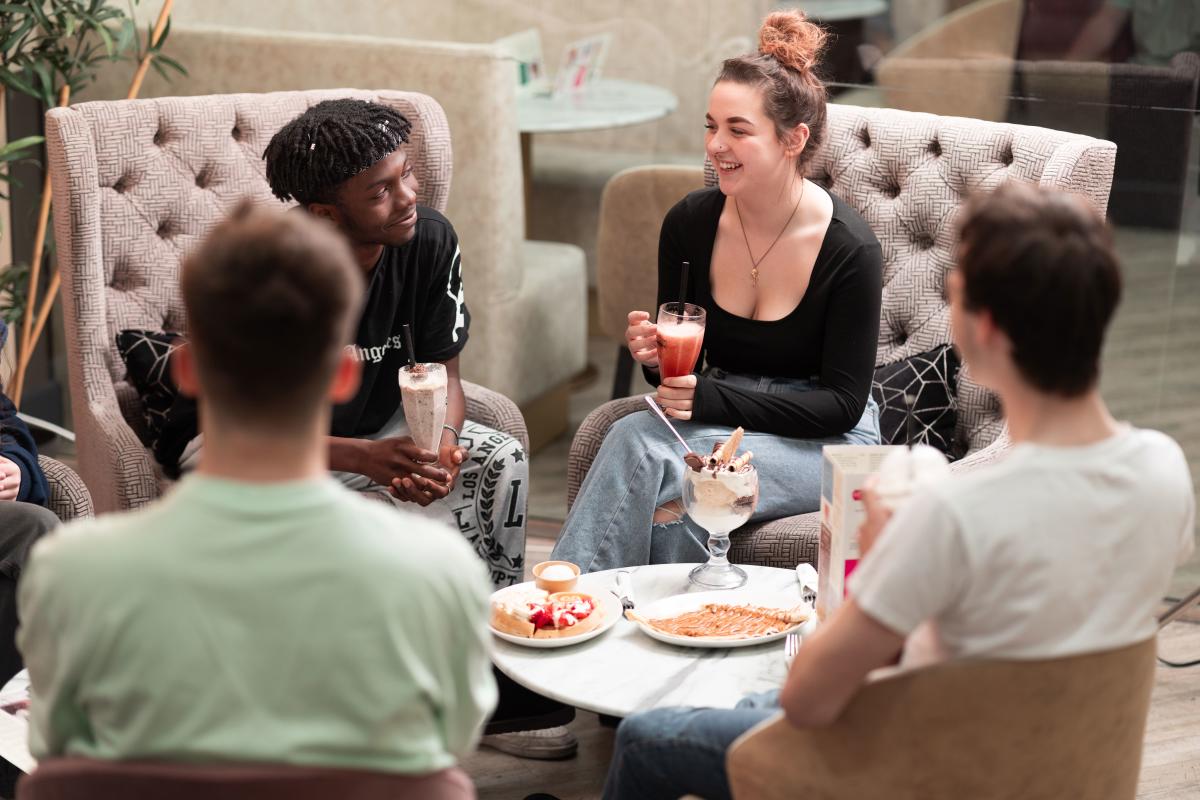 Group of friends enjoying desserts at Sprinkles Gelato