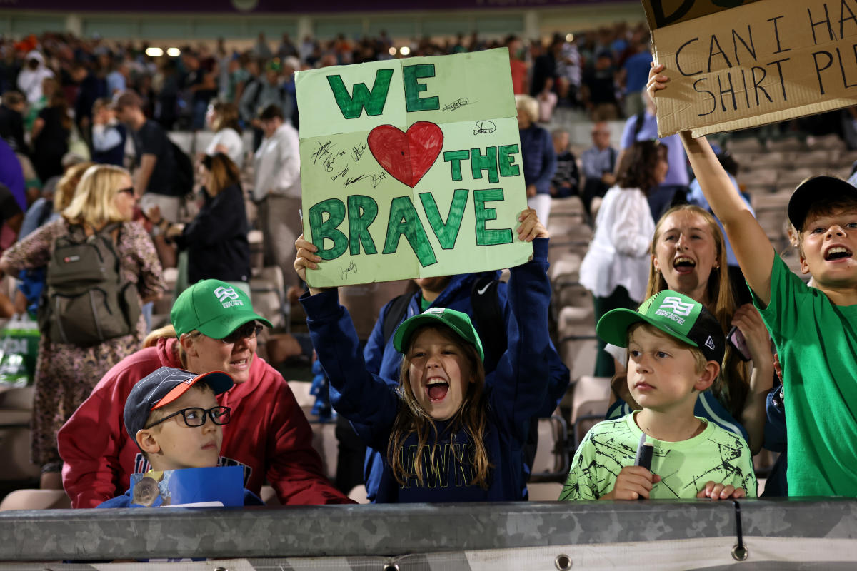 Group of Southern Brave Fans cheering on team at The Hundred