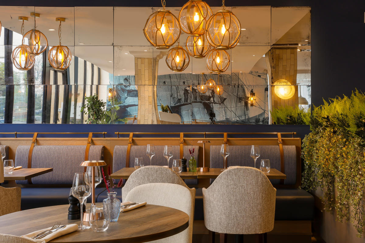 interior seating area of voco hotel's Atlantic Gate restaurant inspired by cruise ships
