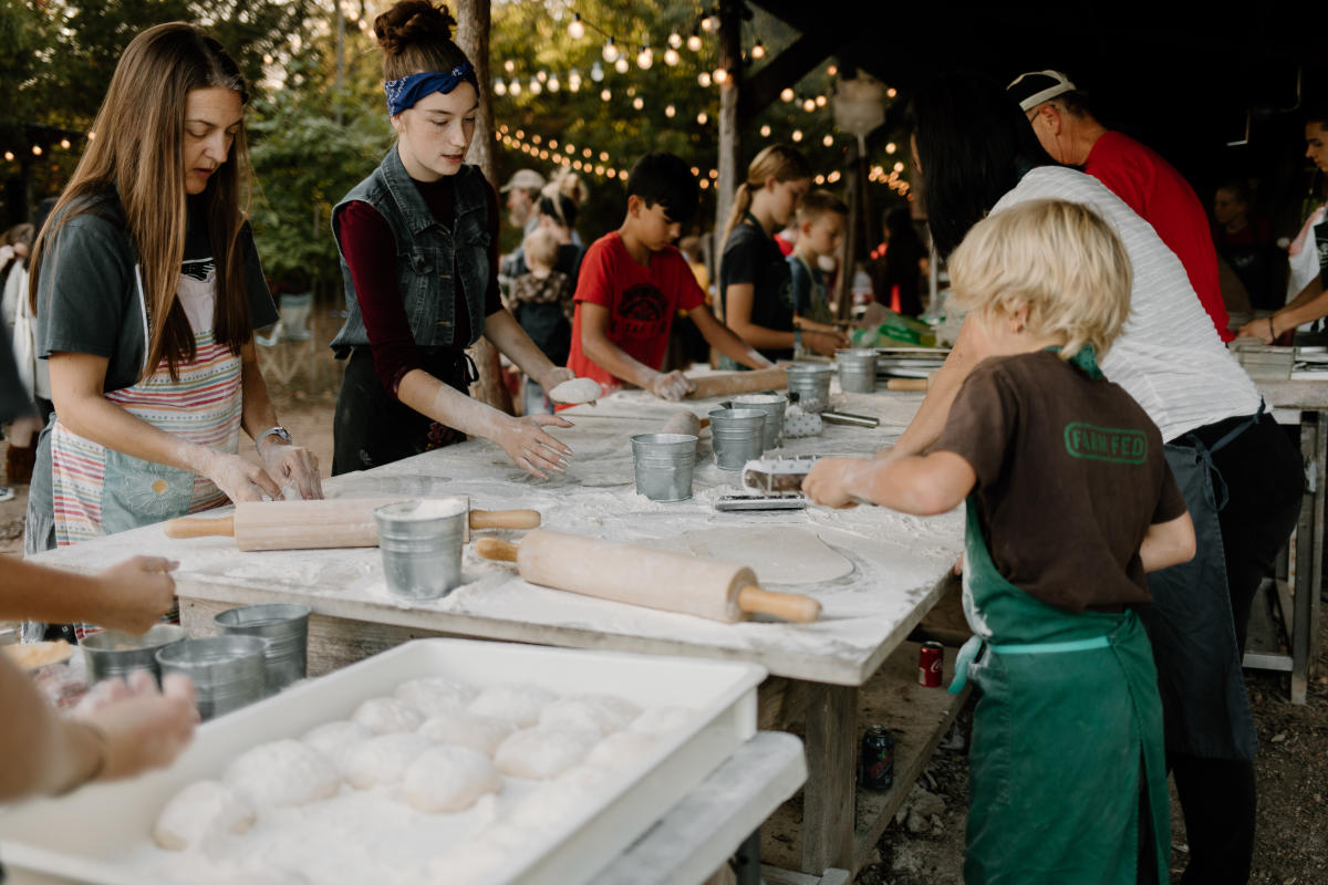 Kids making pizza at Millsap Farm Pizza Night