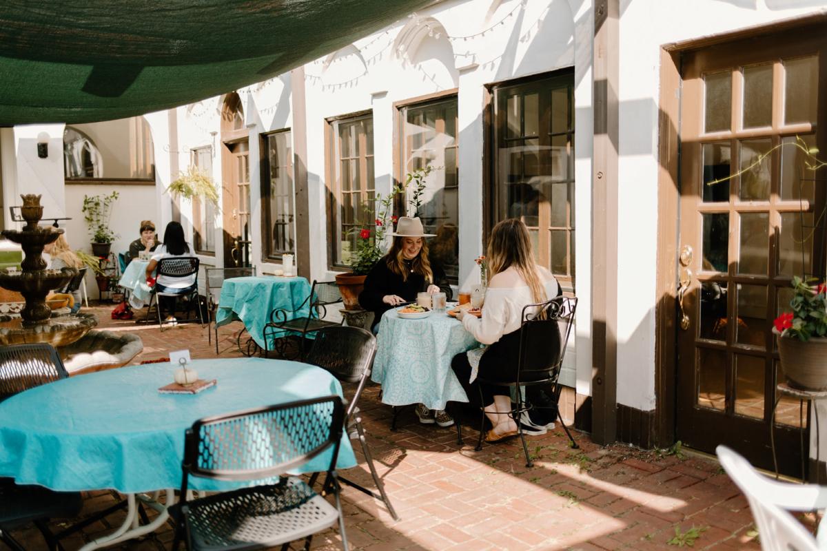 Friends eating on the patio of Tea Bar & Bites