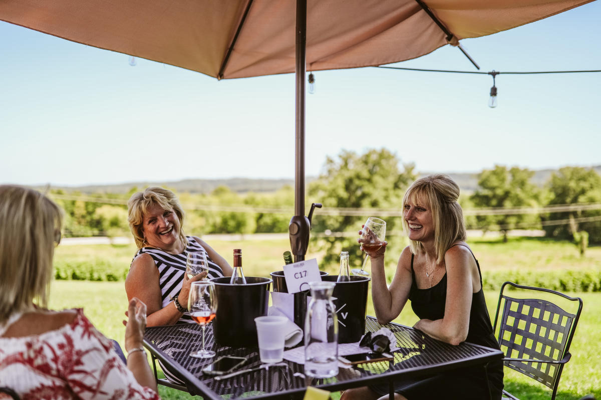 Women eating on terrace of Defiance Ridge Vineyards
