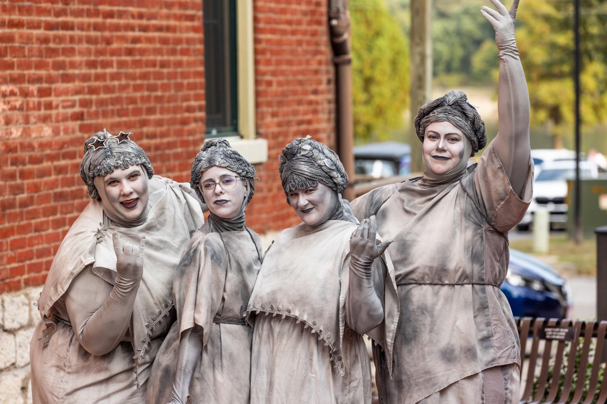 The singing group, The Ghouling Stones, pose for a picture during Legends & Lanterns on Historic Main Street in St. Charles, Missouri.