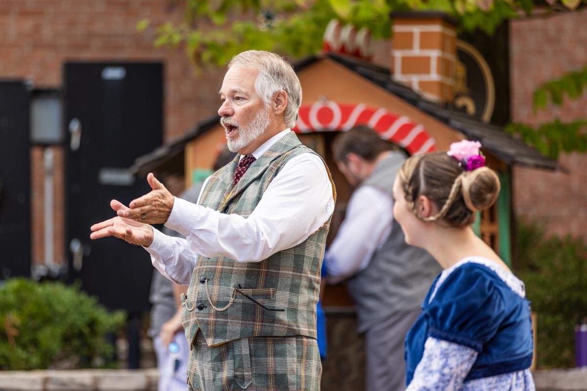 Characters interacting with the crowd at Legends & Lanterns on historic Main Street in St. Charles, MO.