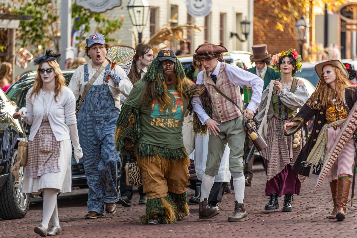 Characters from Legends & Lanterns walk down Historic Main Street in St. Charles, MO.