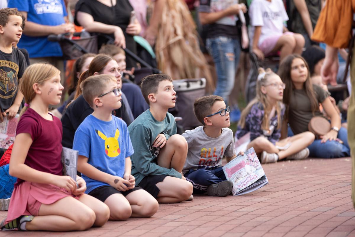 Kids watching a performance at Legends & Lanterns in St. Charles, MO.