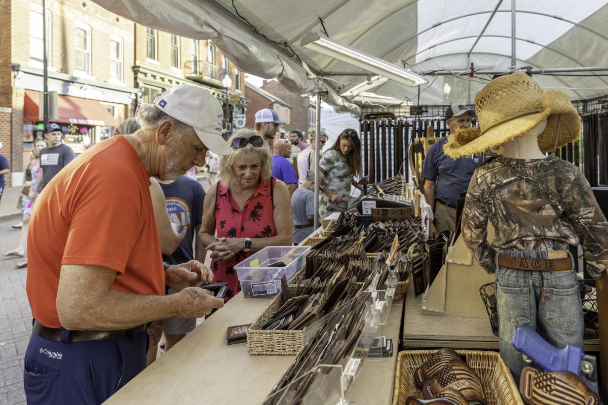 Couple at a Booth at Festival of The Little Hills