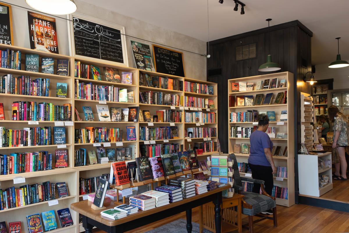 A woman browses bookshelves at Main Street Books in St. Charles, Missouri.