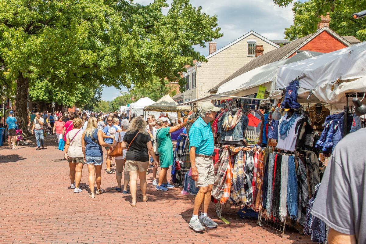 People browsing craft and artisan booths at the Festival of the Little Hills on Main Street St. Charles, Missouri.