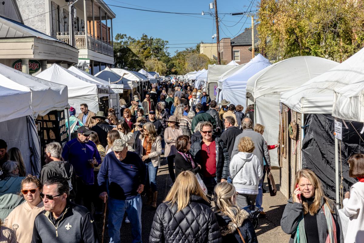 Art lovers and collectors browse hundreds of tents along Columbia Street in downtown Covington at the annual Three Rivers Art Festival.