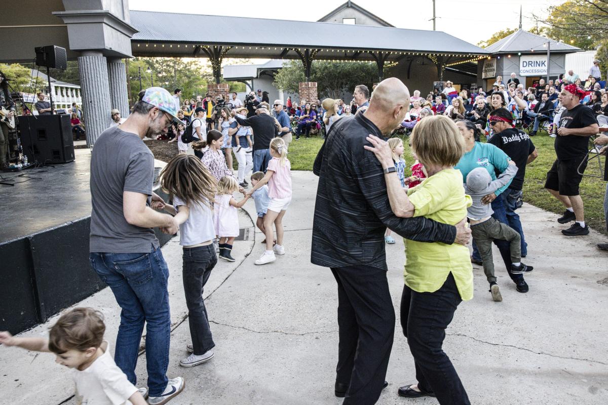 Music lovers of all ages dance at a "Mandeville Live!" Trailhead concert.