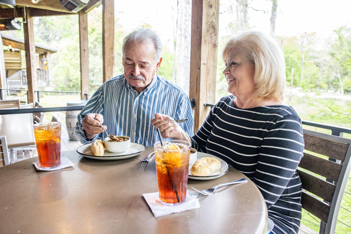 Couple at The Chimes Covington enjoying gumbo