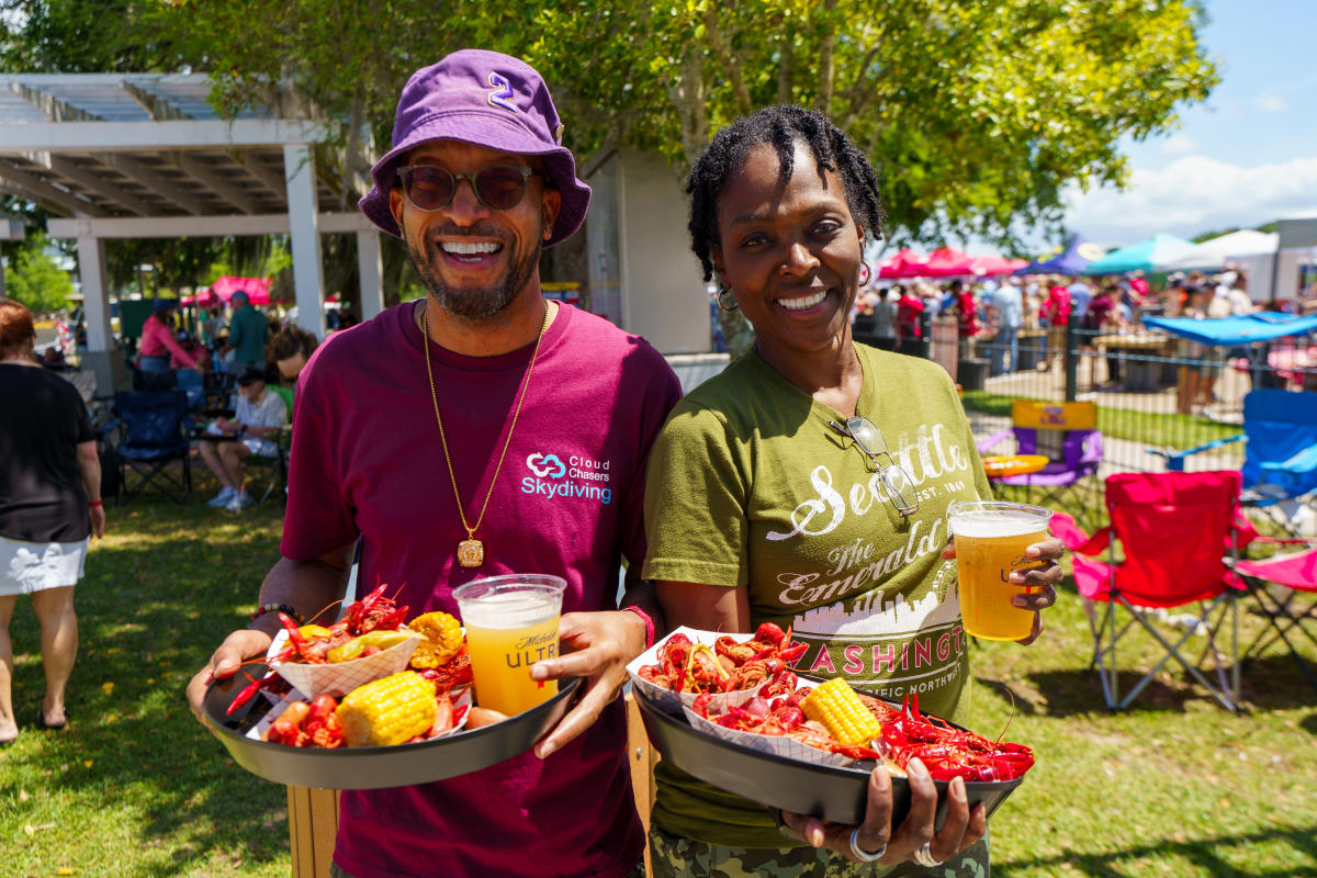Couple posing for picture the the Mandeville Crawfish cooking for a cause event in April 2026