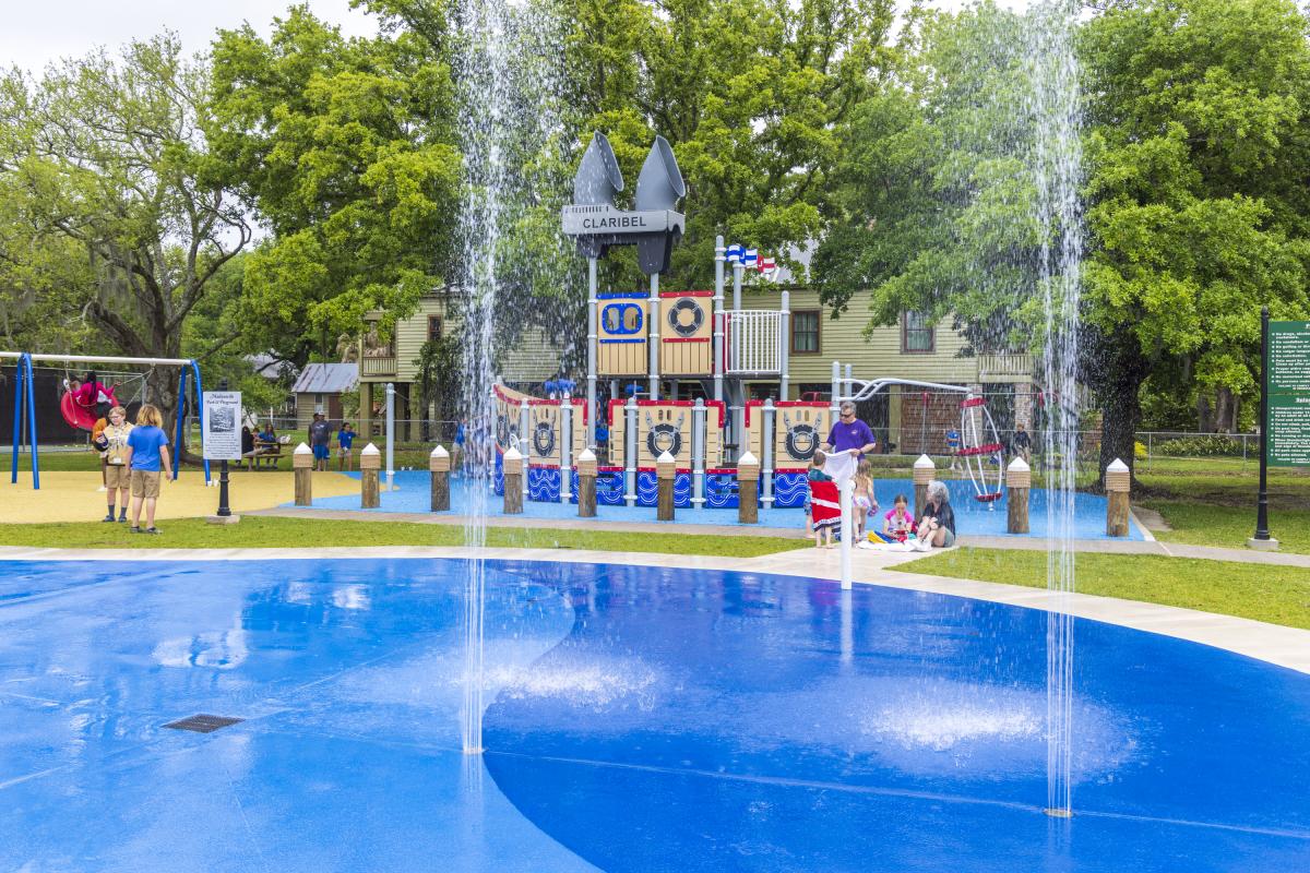 Water spouts straight into the air at the Madisonville Park, Playground and Splash Pad