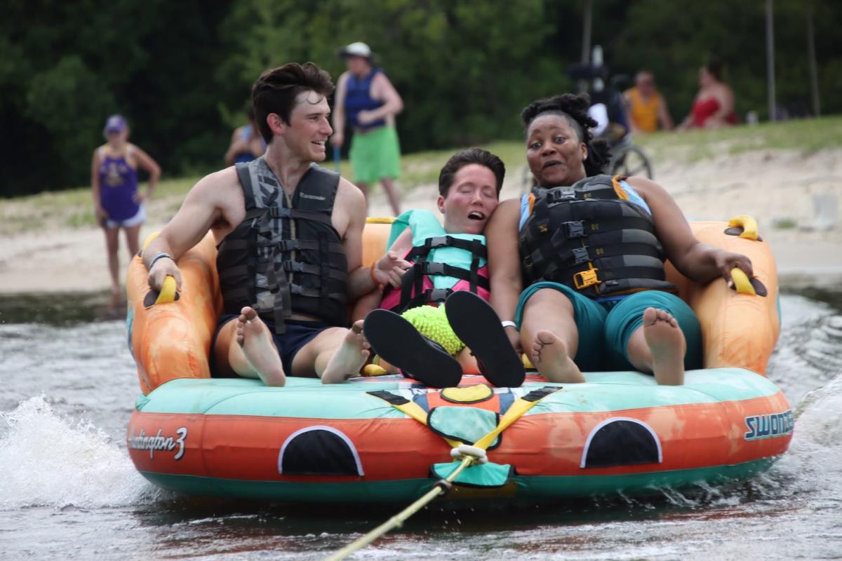 PJ Paulsell enjoys a tubing adventure on the Pearl River with volunteers from Ski Dawgs and Ainsley's Angels, organizations that help people with disabilities experience adaptive outdoor recreation.