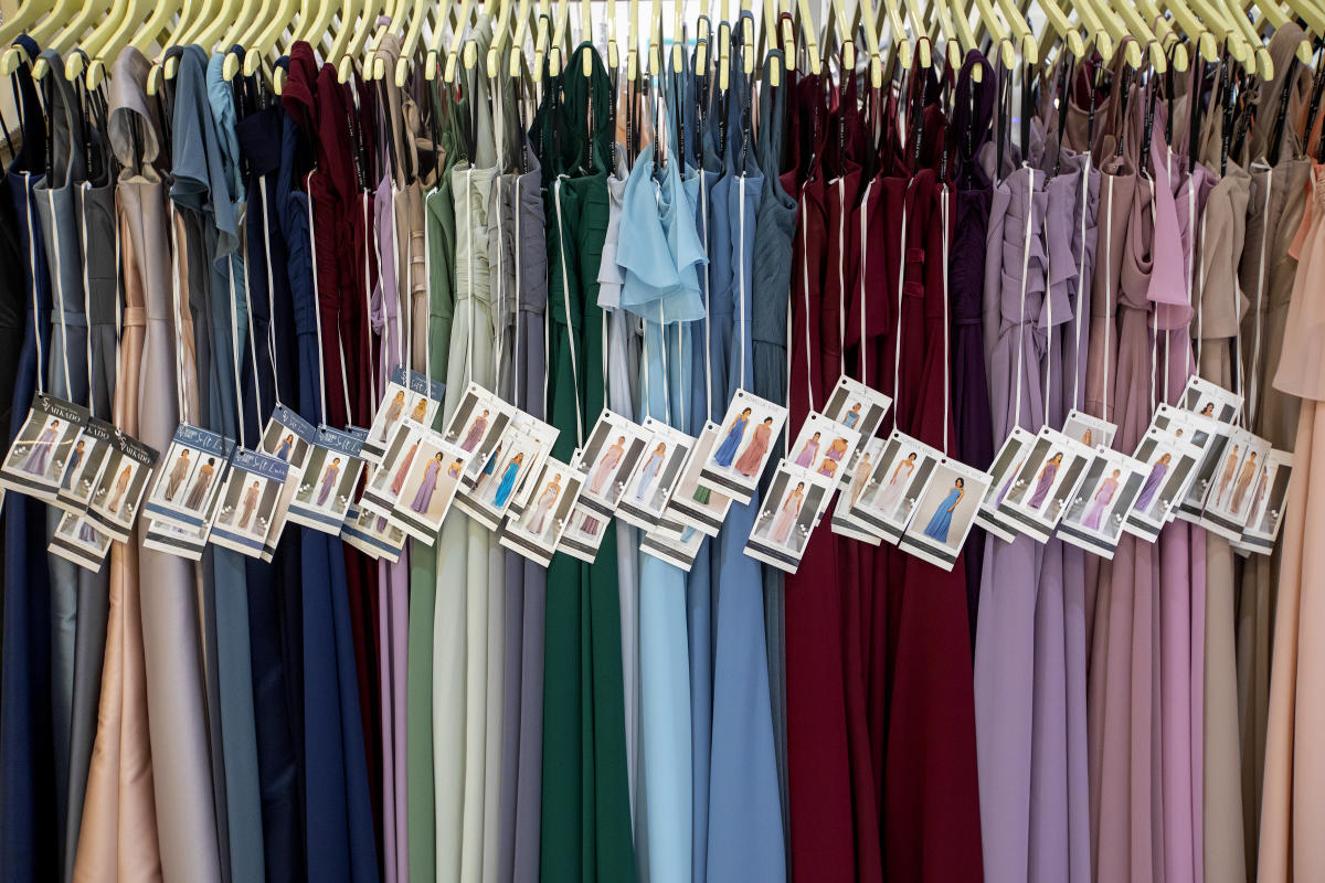 Row of bridesmaid dresses in an assortment of colors
