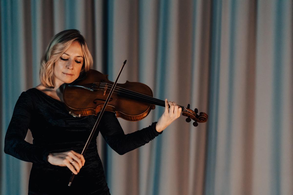 Woman playing a viola.