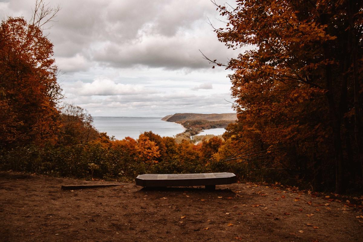 Bench Overlooking A Lake On The Empire Bluff Trail