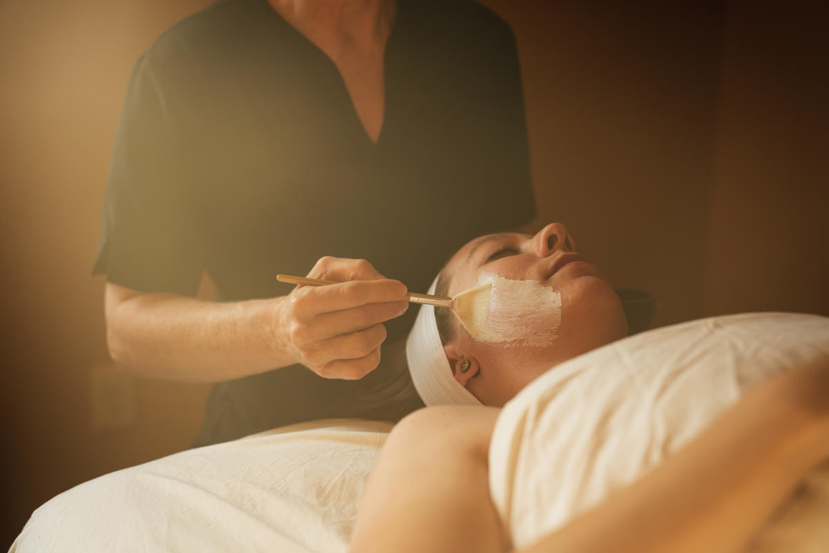 woman receiving a facial at Hacienda Del Sol Spa