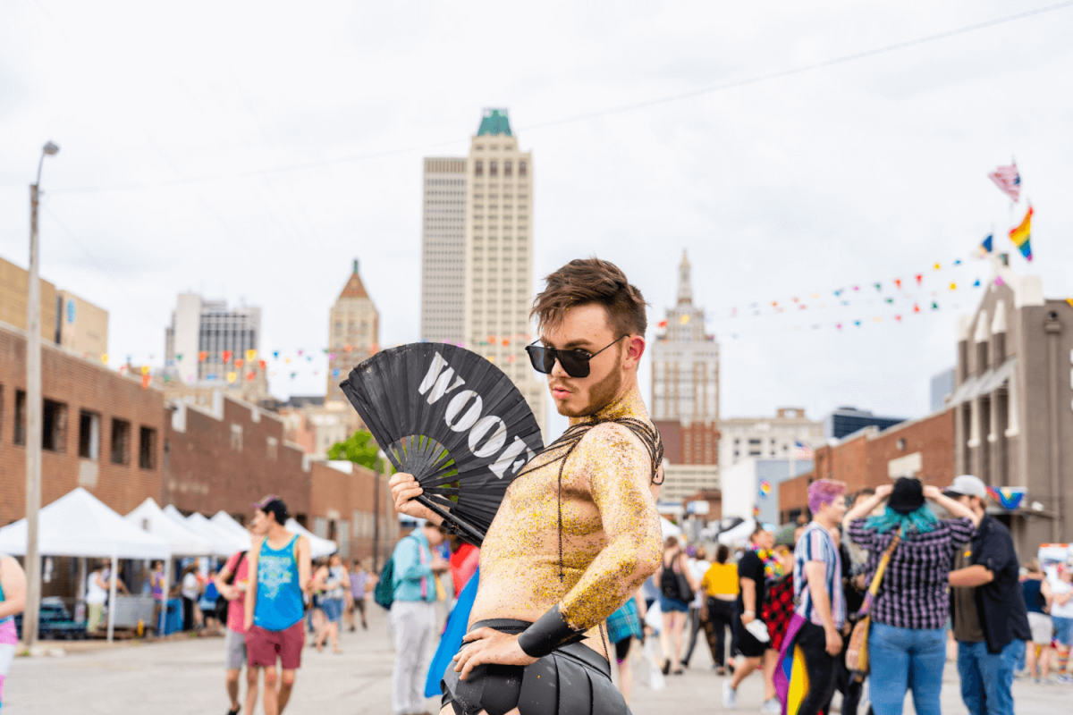 Someone posing during the Pride parade in downtown Tulsa