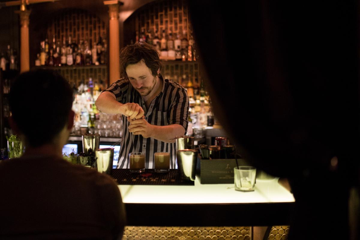 Bartender making drinks at MixCo