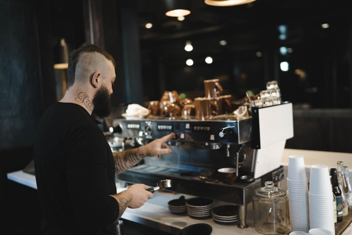 Man making coffee at a coffee shop